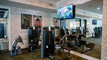 a gym with cardio machines and a flat screen tv at Kendall Park Too, Columbus Ohio